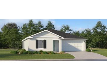 Charming single-story home with a well-manicured lawn and attached two-car garage at 1133 Hour Glass Rd, Lakeland, FL 33801