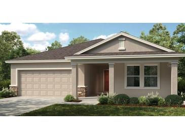 Charming single-story home with a two-car garage and a welcoming covered entryway at 2415 Slippery Rock St, Auburndale, FL 33823
