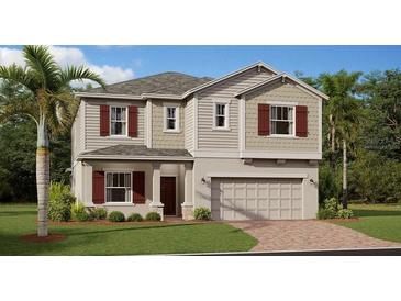 Charming two-story home with neutral siding, red shutters, and a well-manicured lawn at 4654 Ackee Rd, Kissimmee, FL 34758