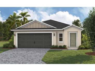 Charming single-story home with a brick driveway and attached two-car garage at 4015 Gardenia Ave, Lake Hamilton, FL 33851