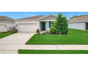 Charming single-Gathering home with well-manicured lawn and freshly landscaped front yard at 800 Reggie Rd, Winter Haven, FL 33884