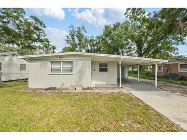 Charming single-story home with a covered carport and well-maintained front lawn at 728 Trenton Rd, Lakeland, FL 33815