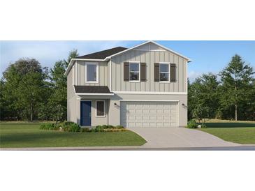 Charming two-story home featuring a two-car garage and well-manicured lawn at 979 Hour Glass Rd, Lakeland, FL 33801
