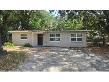 Charming single-story home featuring a well-maintained exterior and a welcoming entrance, plus a driveway at 5222 Montague Pl, Orlando, FL 32808