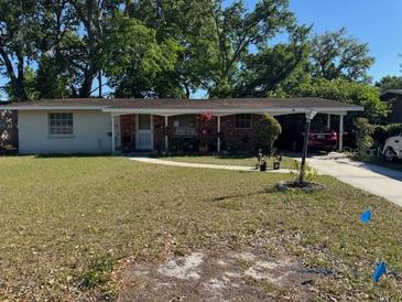 Charming single-story home featuring a carport and front lawn at 534 W Carole St, Lakeland, FL 33803