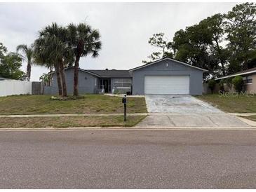 Charming single-story home featuring a two-car garage and mature landscaping at 606 Lakespur Ln, Altamonte Springs, FL 32714