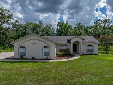 Charming single-story home featuring a well-manicured lawn and inviting curb appeal at 3952 Laurel Branch Dr, Lakeland, FL 33810