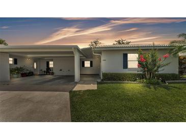 Charming single-story home with a well-manicured lawn and covered parking at 3582 Milano Ave, Lakeland, FL 33803