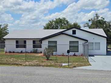 Charming single-story home featuring fresh exterior paint, new roof and meticulously maintained landscaping at 17 Oak Loop, Ocala, FL 34472