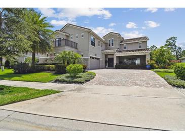 Stunning two-story home featuring lush landscaping and a circular driveway, blending elegance with curb appeal at 9080 Morgana Ct, Winter Garden, FL 34787