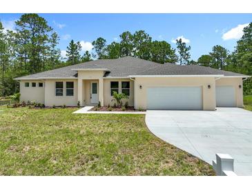 Charming single-story home with well-manicured lawn and attached two car garage at 19041 Mardi Gras St, Orlando, FL 32833