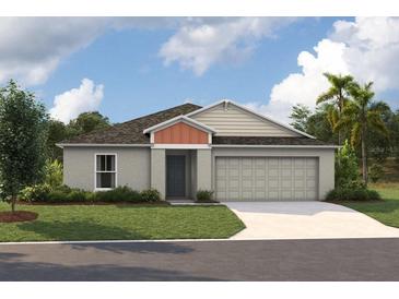 Charming single-story home features a two-car garage, neutral color palette and a well-manicured lawn at 1712 Vanilla St, Haines City, FL 33844