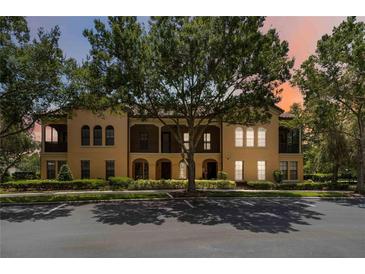 Beautiful two-story townhome with balconies, lush landscaping, and ample parking at 504 Mirasol Cir # 102, Kissimmee, FL 34747