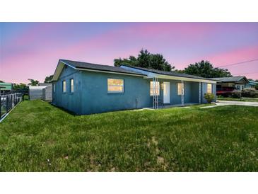 Charming single-story home with a well-maintained lawn and cozy front porch at 2902 Wheeler St, Bartow, FL 33830