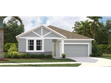 Charming single-story home with a two-car garage, stone accents, and tropical landscaping at 5722 Cattle Ranch Drive, St Cloud, FL 34771