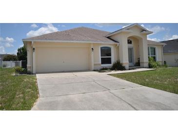 Charming single-story home with a well-maintained lawn and a two-car garage at 3629 Welsh Way, Lakeland, FL 33813