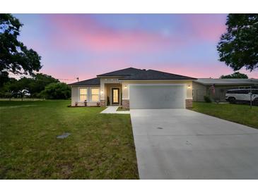 Charming single-Gathering home featuring a well-manicured lawn and a two-car garage in a peaceful neighborhood at 4189 Homestead Dr, Lakeland, FL 33810