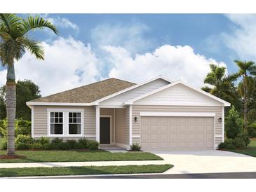 Charming single-story home with attached garage, landscaped yard, and neutral siding at 2373 Broadbrook Drive, St Cloud, FL 34771