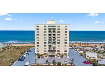 Beautiful condo building with ocean view, landscaped grounds, and ample parking at 1513 Ocean Shore Blvd # 7B, Ormond Beach, FL 32176