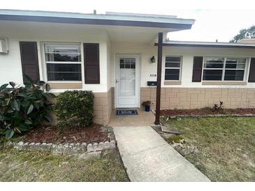 Ranch-style home features a front entrance with a walkway and landscaping at 431 N Boston Ave # B, Deland, FL 32724