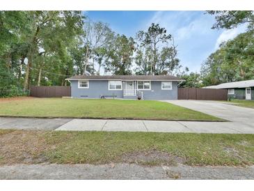 Charming single-story home with a well-maintained lawn and neutral exterior paint at 714 E Michigan Ave, Deland, FL 32724
