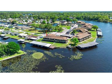 Waterfront condo complex features boat slips and a beautiful view of the surrounding landscape at 1640 Juno Trl # 205A, Astor, FL 32102