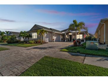 Attractive single-story home with a paved driveway and lush landscaping at 2815 Sienna View Ter, New Smyrna Beach, FL 32168
