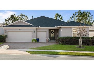 Beautiful one-story home with a two-car garage and landscaped lawn at 3558 Nw 56Th Ave, Ocala, FL 34482