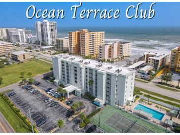 Ocean Terrace Club condo building aerial view, showing pool, tennis court, and parking at 3800 S Atlantic Ave # 4080, Daytona Beach, FL 32118