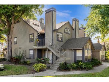 Two-story townhome with mature landscaping and a private entrance at 963 Helmsley Ct # 207, Lake Mary, FL 32746