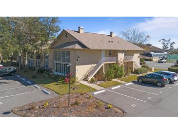 Charming two-story condo with private balconies, lush landscaping, and convenient parking spaces at 689 Wellington Station Blvd # 41, Ormond Beach, FL 32174