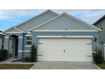 Charming one-story home with light blue exterior and white garage door at 1209 August Sky Dr, Deltona, FL 32738