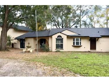 Ranch style home with a large front yard and fountain at 8101 Via Bonita St, Sanford, FL 32771