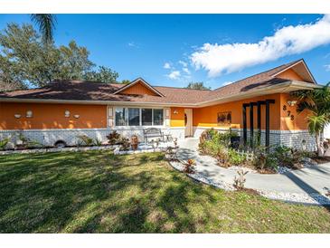 Charming home featuring a landscaped front yard with a sidewalk and stylish accents at 878 Abbott Ave, Deltona, FL 32725