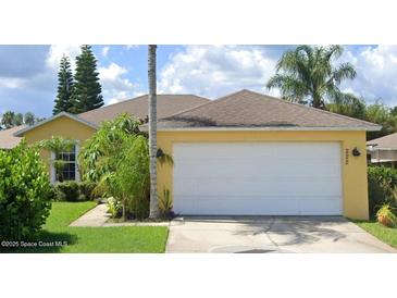 Single-story house with attached garage and landscaped yard at 222 Oak Branch Dr, Edgewater, FL 32141