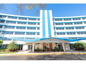 Building exterior showcasing a mid-century modern design with blue and white color scheme at 1224 S Peninsula Dr # 511, Daytona Beach, FL 32118
