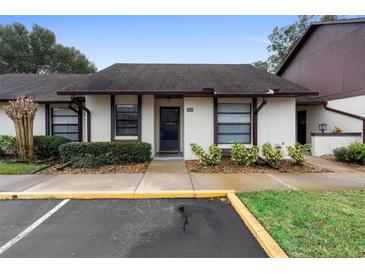 Condo exterior featuring a well-maintained facade and landscaping at 245 Terrace Hill Blvd # 1E, Debary, FL 32713