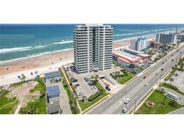 Aerial view of beachfront high-rise building with ocean and road views at 1420 N Atlantic Ave # 1102, Daytona Beach, FL 32118