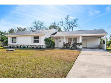 Charming single story home with carport and well-manicured lawn at 1612 Beatrice Dr, Orlando, FL 32810