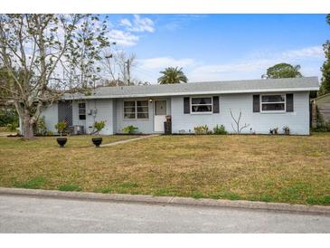 Charming single-story home with a well-maintained lawn and inviting curb appeal at 303 Warwick Ave, Ormond Beach, FL 32174