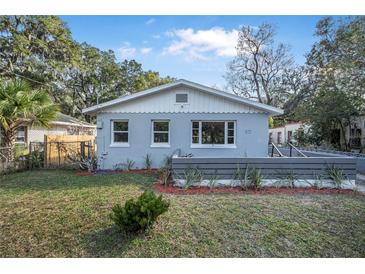 Charming home featuring fresh exterior paint, manicured lawn, and decorative front accents at 829 Madison Ave, Daytona Beach, FL 32114