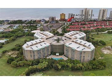 Wonderful aerial view of this condo building with a beach access walkway nearby at 4 Oceans West Blvd # 601A, Daytona Beach Shores, FL 32118