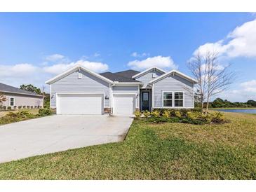 Charming single-story home with a three-car garage and well-maintained landscaping at 2236 Oconnel Dr, Ormond Beach, FL 32174