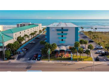 Oceanfront hotel featuring an outdoor Tiki bar and direct beach access at 313 S Atlantic Ave # 6140, Daytona Beach, FL 32118