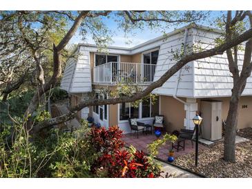 Charming home with a patio, balcony, and lush landscaping at 4150 S Atlantic Ave # 104 B, New Smyrna Beach, FL 32169