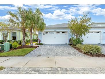Charming single-story home with paver driveway and two-car garage at 583 Lost Shaker Way, Daytona Beach, FL 32124