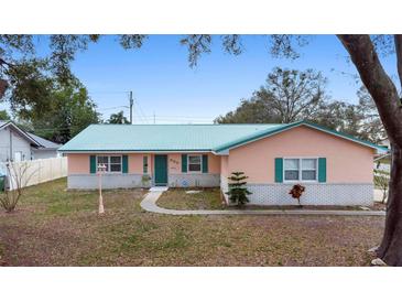 Charming single-story home with a well-maintained lawn and attractive curb appeal at 980 Buttercup Ter, Deltona, FL 32725