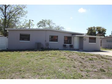 Charming single-story home with a well-maintained lawn and an inviting entrance at 1103 Malcom Rd, Ocoee, FL 34761