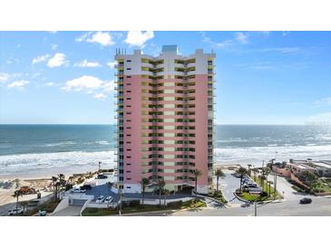 Stunning beachfront condo building with multiple floors and private balconies at 1900 N Atlantic Ave # 1603, Daytona Beach, FL 32118