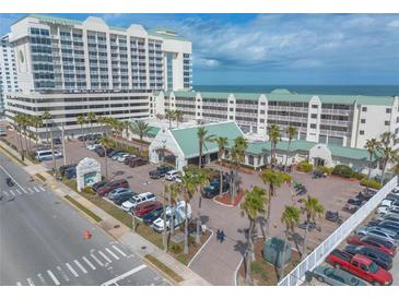 Coastal resort featuring large buildings, palm trees, and a parking lot near the beach at 2700 N Atlantic Ave # 454, Daytona Beach, FL 32118